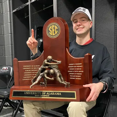 Anders Ericson holding the 2020 SEC Championship Trophy for the University of Alabama