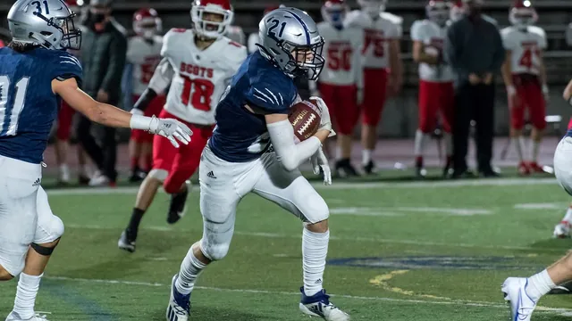 A Wilsonville ball carrier runs past a defender