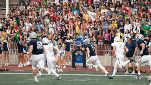 Mark Wiepert runs down the sideline against Nelson