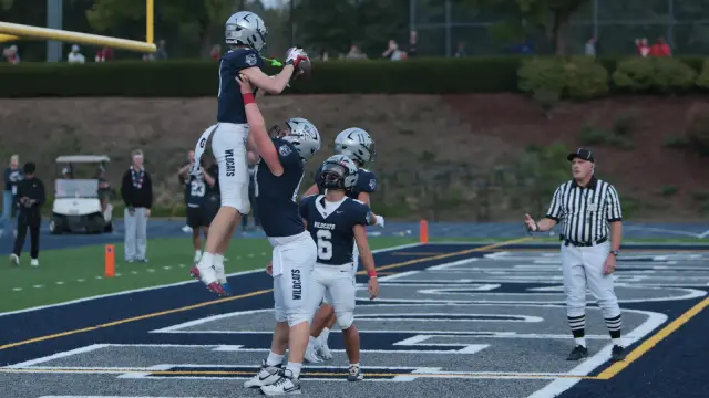 LJ Leland lifted by teammates after a touchdown